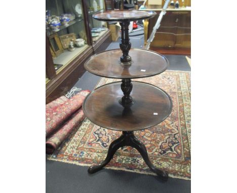 A George III mahogany three tier dumb waiter on wrythen turned column and tripod base, 117 x 63cm  