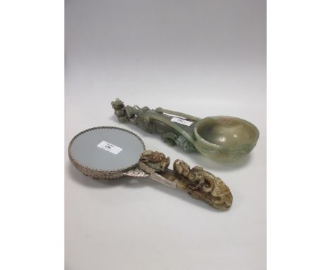 A Chinese carved hardstone ladle together with a mirror with belt hook handle  