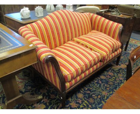 A reproduction two seater humpback sofa with scroll arms, upholstered in red and ochre striped fabric, 88 x 155 x 82cm  