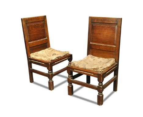 A set of six oak Arts & Crafts dining chairs, each with rectangular panelled back supported on two turned and two square sect