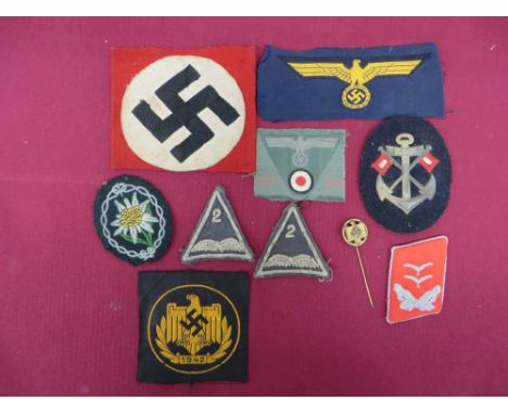 German Third Reich Cloth Insignia.  Includes Kriegsmarine BeVo breast eagle ... Army triangular cap eagle and roundel ... Luf