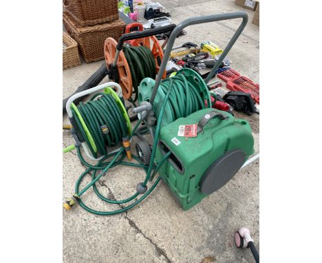 FOUR VARIOUS HOSE PIPE REELS WITH HOSES 