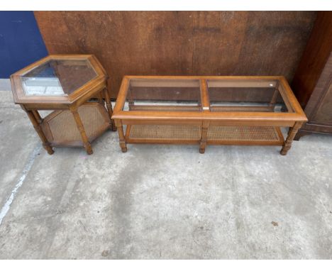 A TWO TIER COFFEE TABLE WITH INSET GLASS TOP AND CANE LOWER SHELF, 50 X 21" AND MATCHING HEXAGONAL LAMP TABLE, 27.5" ACROSS 