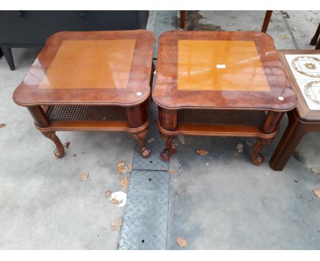 A PAIR OF BURR WALNUT LAMP TABLES WITH CANE MAGAZINE SHELF 