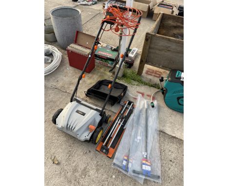 AN ASSORTMENT OF TOOLS TO INCLUDE A TILE CUTTER AND VONHAUS LAWN RAKE ETC 