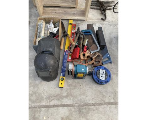 AN ASSORTMENT OF TOOLS TO INCLUDE A BLACK AND DECKER BENCH GRINDER, WELDING RODS, WELDINGT MASKS AND SAWS ETC 
