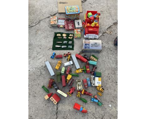 AN ASSORTMENT OF VINTAGE DIE CAST VEHICLES, CAP BADGES AND PLAYING CARDS ETC 