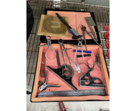 AN ASSORTMENT OF TOOLS TO INCLUDE MEASURING CALIPERS AND SET SQUARES ETC 