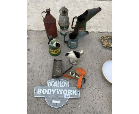 AN ASSORTMENT OF VINTAGE OIL CANS AND A METAL SIGN ETC 