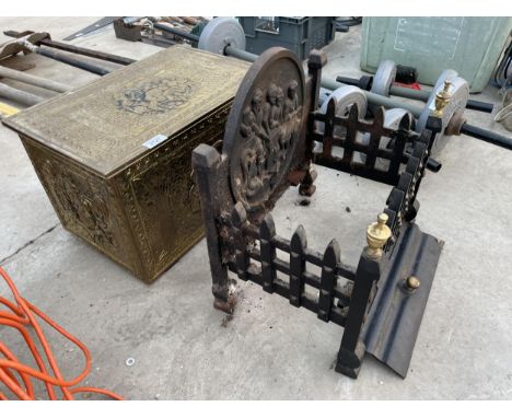 A DECORATIVE CAST FIRE GRATE AND A BRASS COAL BOX 