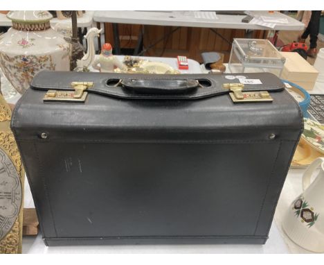 A VINTAGE BLACK SUITCASE WITH CODE LOCKS 