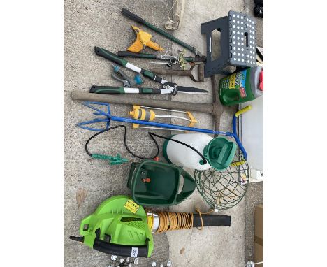 A COLLECTION OF GARDEN HAND TOOLS AND HARDWARE TO INCLUDE PICK AXE. ETC 