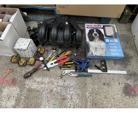 AN ASSORTMENT OF ITEMS TO INCLUDE HAND TOOLS AND A DOG DOOR ETC 