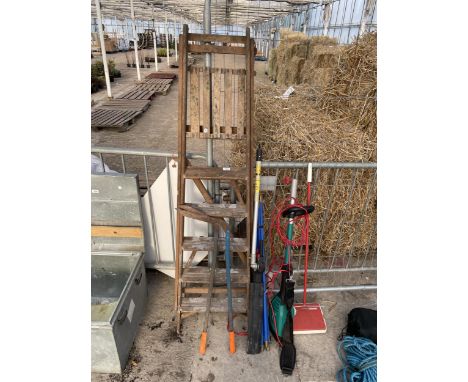 AN ASSORTMENT OF TOOLS TO INCLUDE A WOODEN STEP LADDER, DRAINING RODS AND A BOSCH ELECTRIC LONG REACH HEDGE CUTTER ETC 