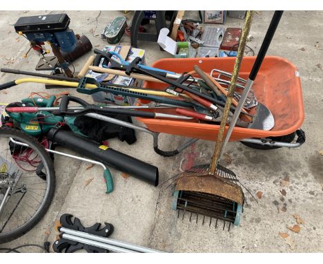 A WHEELBARROW AND GARDEN TOOLS TO INCLUDE STAINLESS STEEL GARDEN FORKS, ETC 