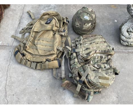 TWO CAMMO BAGS AND A CAMMO HELMET 