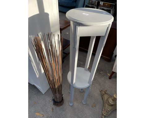 A PAINTED TWO TIER JARDINIERE STAND AND REED LAMP 
