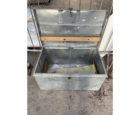 A LARGE GALVANISED TRAVEL/STORAGE TRUNK 