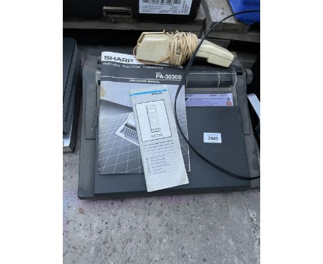 A SHARP PORTABLE TYPEWRITER 