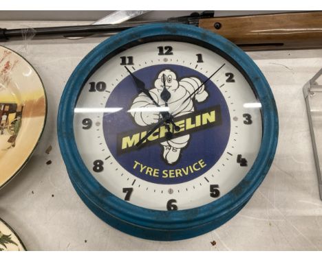A MICHELIN MAN WALL CLOCK 