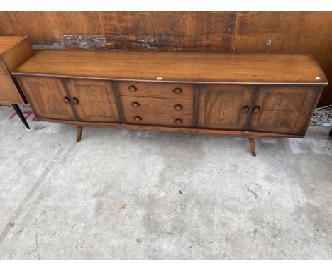 A LONG, POSSIBLY ERCOL ELM SIDEBOARD ENCLOSING THREE DRAWERS AND FOUR CUPBOARDS, 93" WIDE 