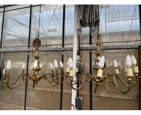 A PAIR OF EIGHT BRANCH BRASS CEILING LIGHT CHANDELIERS 