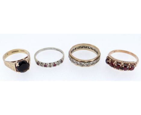 FOUR ASSORTED RINGS comprising 9ct white gold ruby and diamond ring, 9ct gold five stone garnet ring, 9ct gold gem set ring a