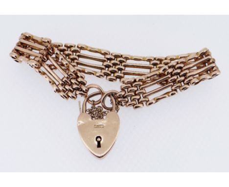 9CT GOLD GATE LINK BRACELET with heart shaped padlock, 20.4gmsComments: some links compressed/bent, padlock dented and wire m