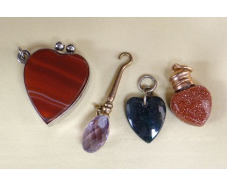 ASSORTED JEWELLERY comprising heart shaped agate set cigar cutter pendant, two further heart pendants and button hook (4)