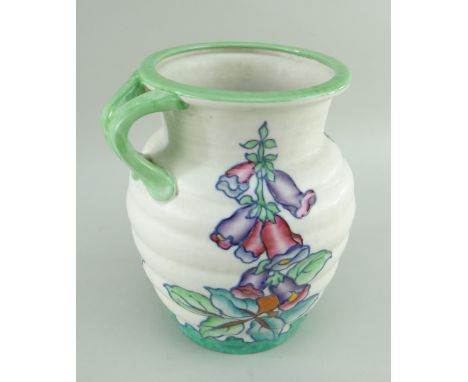 CHARLOTTE RHEAD FOR CROWN DUCAL, a ribbed Foxglove pattern jug, c.1937,  no. 4953, tube lined enamel decoration, 20.5cms high