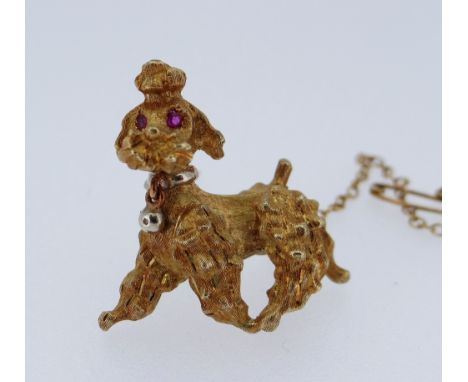 18CT GOLD POODLE BROOCH of textured design with ruby eyes, 12.2gms, in 'Westgate Jewellers' box