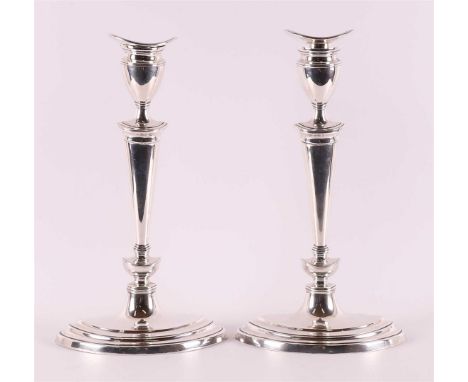 A pair of silver one-light candlesticks, England, London, Mapping &amp; Webb Co., year letter 1902. Marked on the base, h 31 