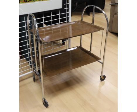A vintage ADT serving trolley/tea trolley with brown plastic tops, 1950s, h 79 x l 65 x d 41 cm.