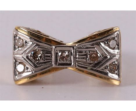 A 14 kt 585/1000 gold butterfly ring with 7 diamonds of 0.45 crt in total, circa 1950, ring size Ø 18 mm.