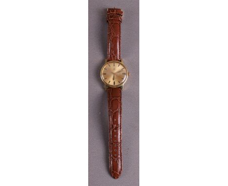 A vintage Omega Genève Sunburst men's wristwatch on a brown leather strap, 1969. Mechanical movement with hand winding, ref. 