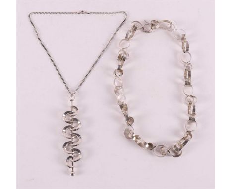 A vintage silver necklace and pendant on a necklace from a later date, 1970s, to. 2x.