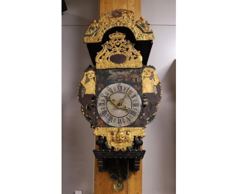 A chair clock, Friesland 19th century. Polychrome decorated wooden chair with cut-out mermaids as cheeks. Hood lead with coat