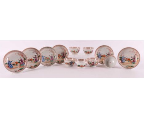 Six porcelain cups and saucers with Mandarin decor, China, Qianlong 18th century. Polychrome decor of figures playing in a ga