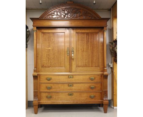 A two-door cabinet, Northern Netherlands, Neo Classicist, early 19th century. Oak, curved profiled hood with carving in the f