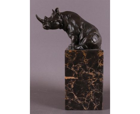 A brown patinated bronze sitting hippopotamus, after an antique example, 21st century. Marked with foundry mark, h 21.5 cm.