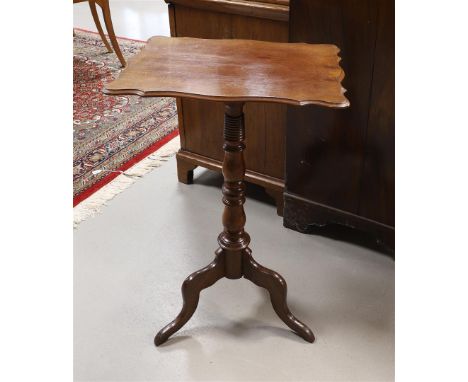 A mahogany side table, Holland, Willem III, 19th century. Contoured rectangular top, twisted trunk, resting on a voluting tri