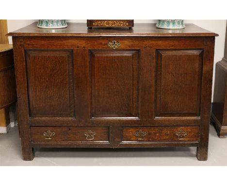 A panel chest, England, provincial, around 1700. Oak, the base cabinet with two drawers and brass fittings, h 88 x l 123 x w 