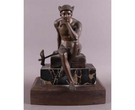 A bronze seated Hermes on cushion and marble base, ca. 1920, h 27.5 cm.