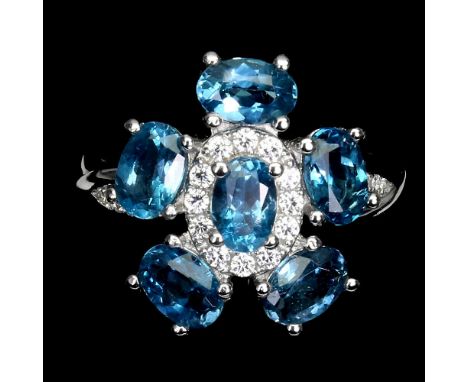 A matching 925 silver flower shaped ring set with London blue topaz and white stones, (N.5).