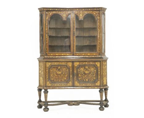 A Dutch inlaid two-tier display cabinet, 19th century, the upper section with carved cresting rail, over twin glazed panel do