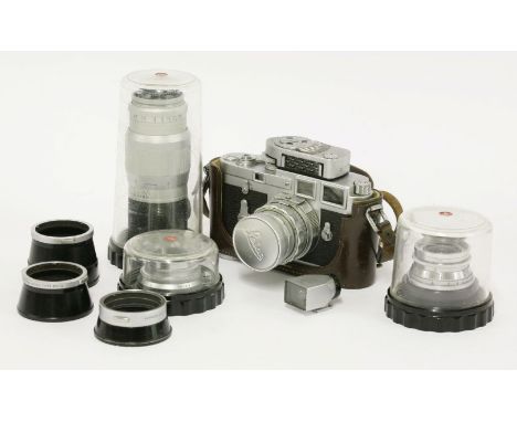 A Leica M3 35mm camera,no. 964958, c. 1954-67, with a 50mm Summicron lens, a viewfinder and ranger finder, three further lens