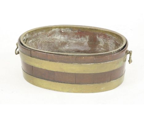 A George III coopered and brass bound planter, with brass handles, later liner, 60cm wide