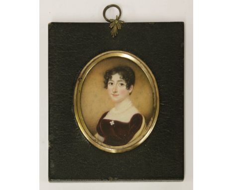 Circle of Andrew Plimer (1763-1837)PORTRAIT OF A LADY, BUST LENGTH, IN A BURGUNDY DRESS Miniature on ivory, oval75 x 61mm