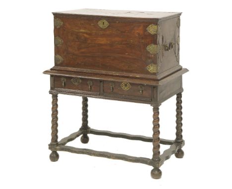 A kingwood parquetry panel casket,late 17th century, the hinged top opening to reveal a plain interior, engraved brackets and