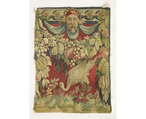 An Aubusson panel,depicting a heron and frog below a fruit garland and bearded mask,59cm wide77cm high